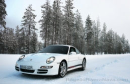 Porsche Camp4, winter driving school, 997 Porsche 911 Carrera 4S in iced road in woods, Rovaniemi, Finland