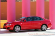 2011 Seat Exeo running shot panning low speed in front of colorful columns, Los Cabos, Baja California, Mexico